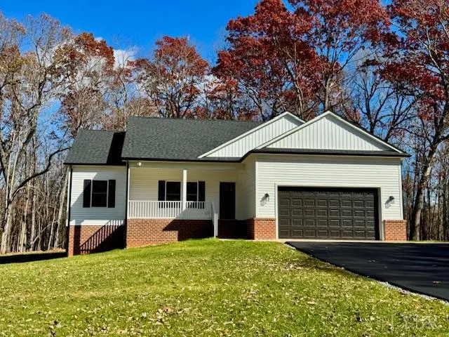 a front view of a house with yard