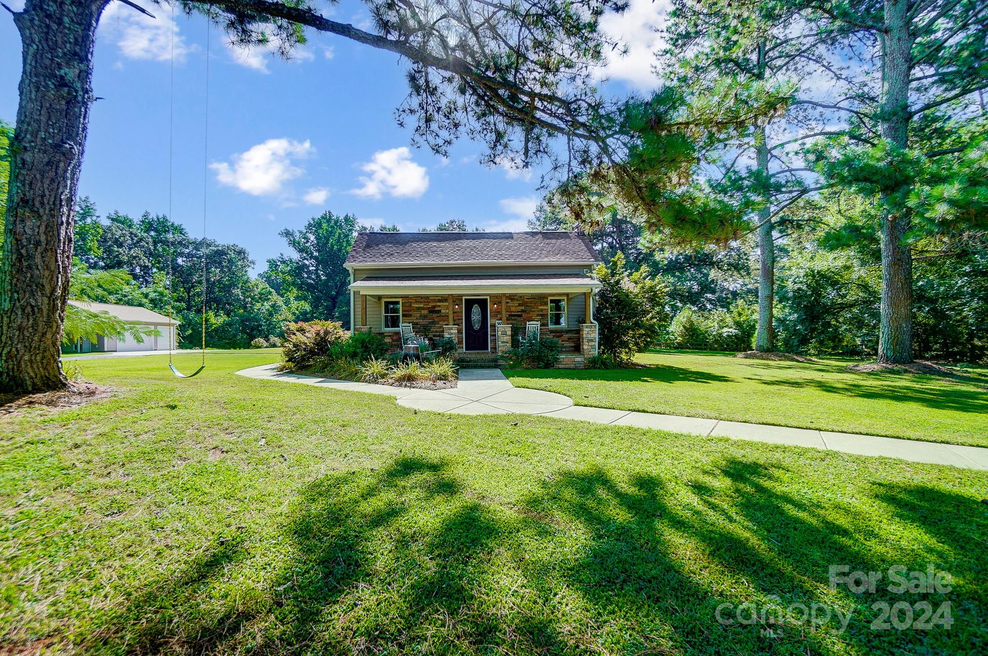 6338 Talley Road Stanfield, NC 28163 - Photo 2 of 48 a view of a house with a yard