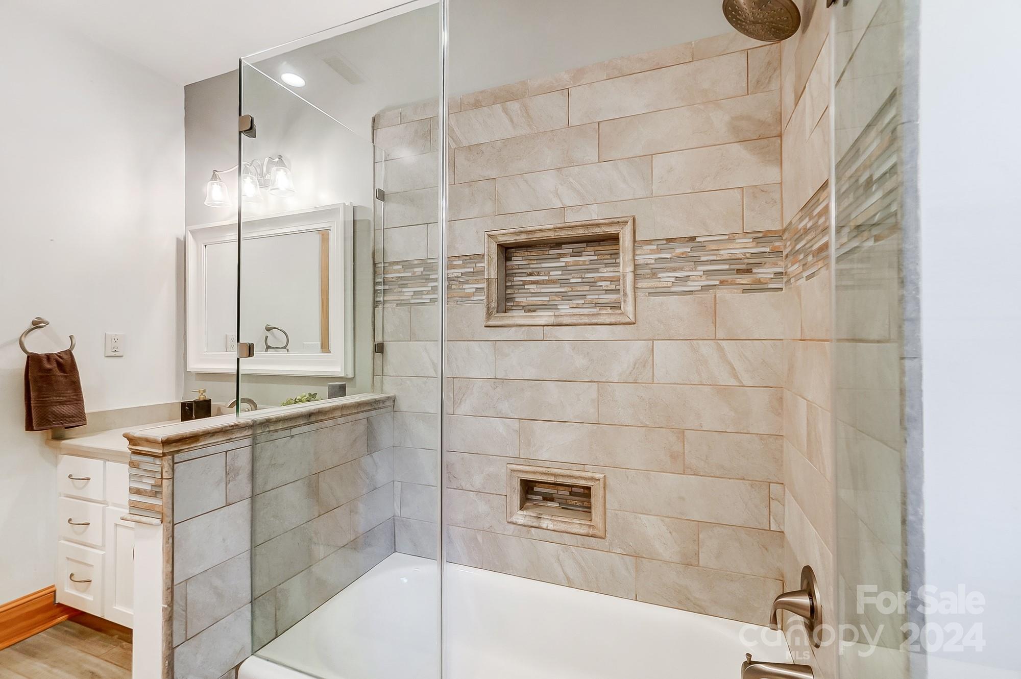 6338 Talley Road Stanfield, NC 28163 - Photo 22 of 48 a bathroom with a granite countertop sink a toilet and shower