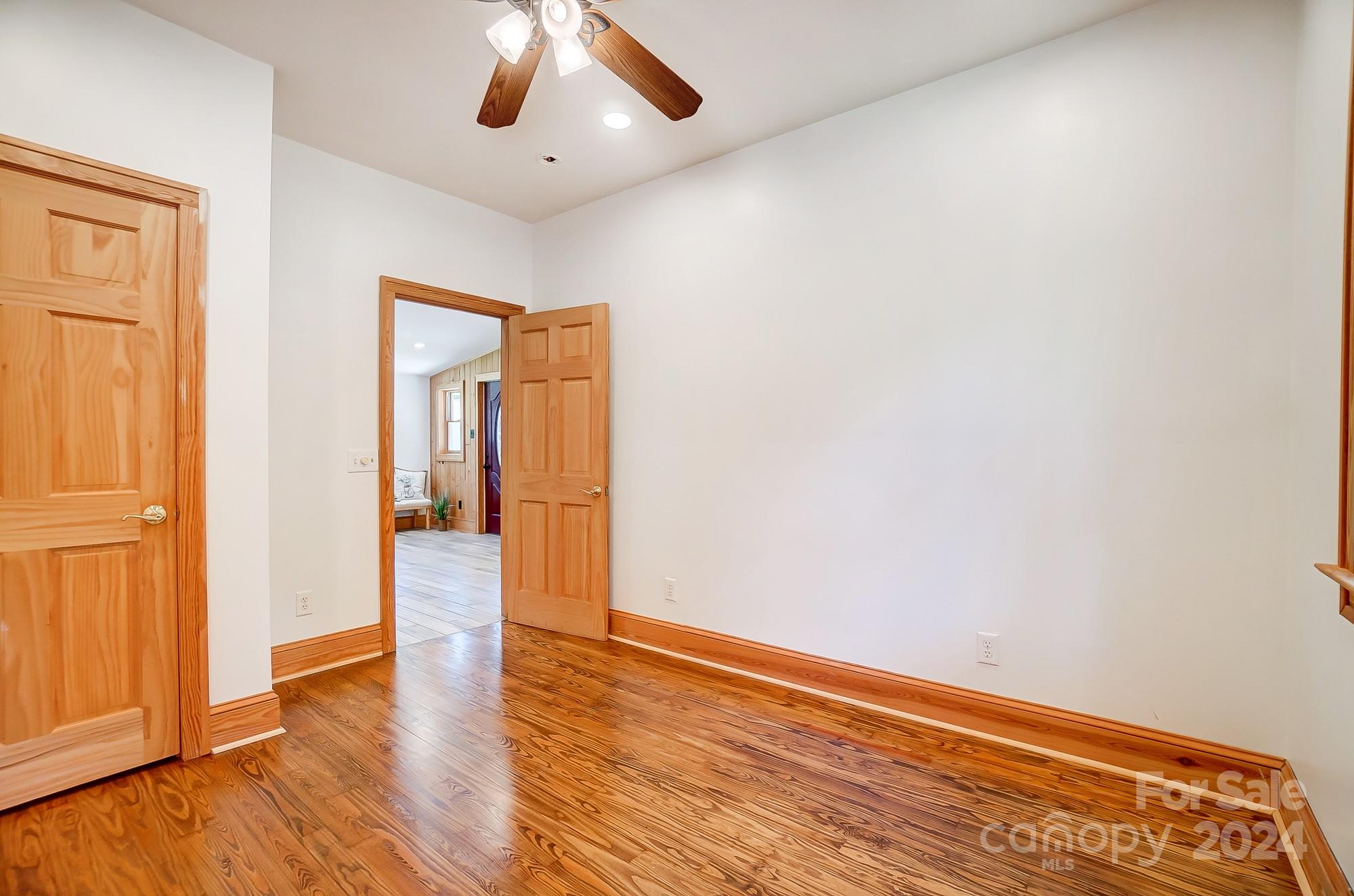 6338 Talley Road Stanfield, NC 28163 - Photo 25 of 48 a view of an empty room with wooden floor