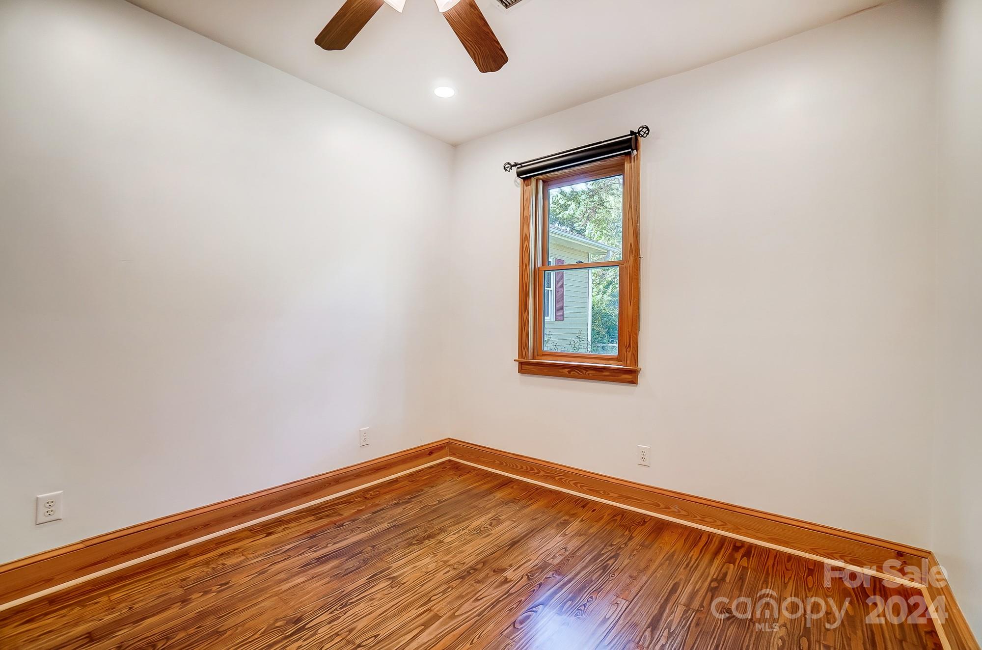 6338 Talley Road Stanfield, NC 28163 - Photo 26 of 48 an empty room with ceiling fan and window
