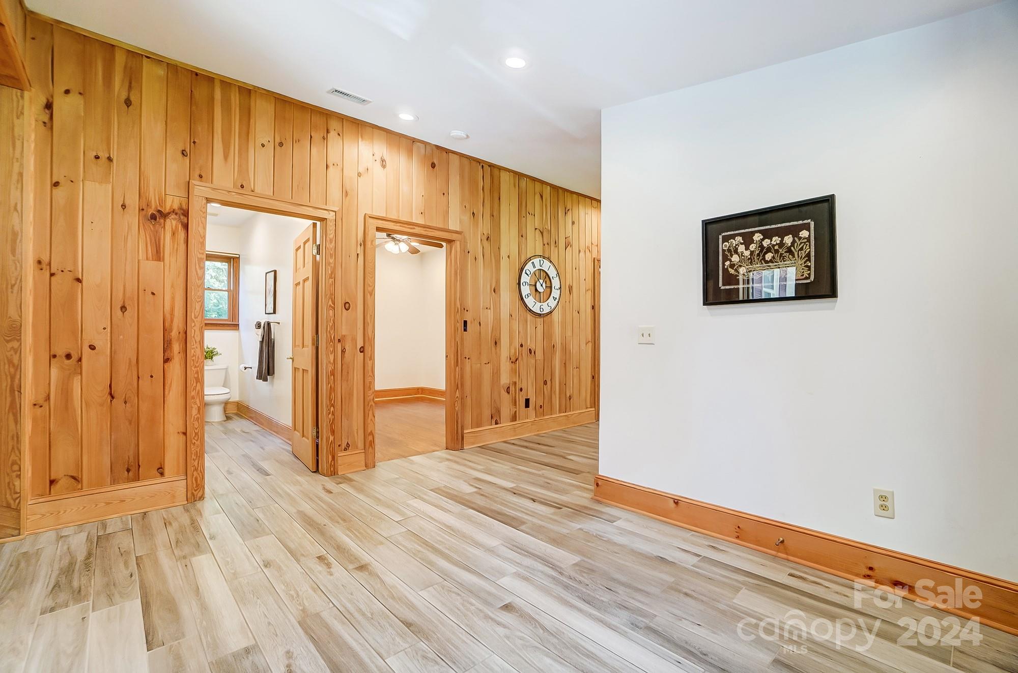 6338 Talley Road Stanfield, NC 28163 - Photo 29 of 48 a view of a hallway with wooden floor and bathroom