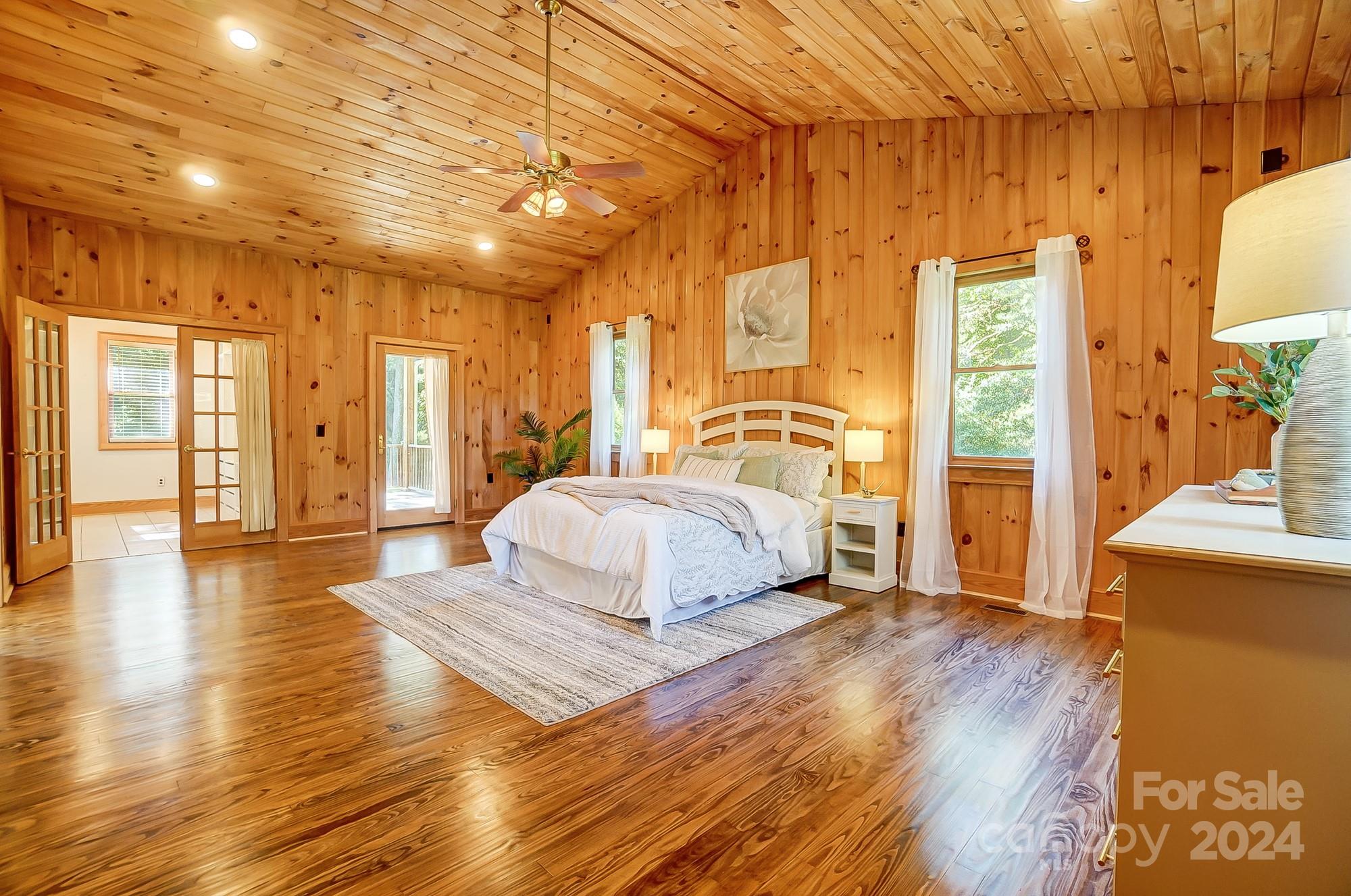 6338 Talley Road Stanfield, NC 28163 - Photo 33 of 48 a spacious bedroom with a bed and wooden floor