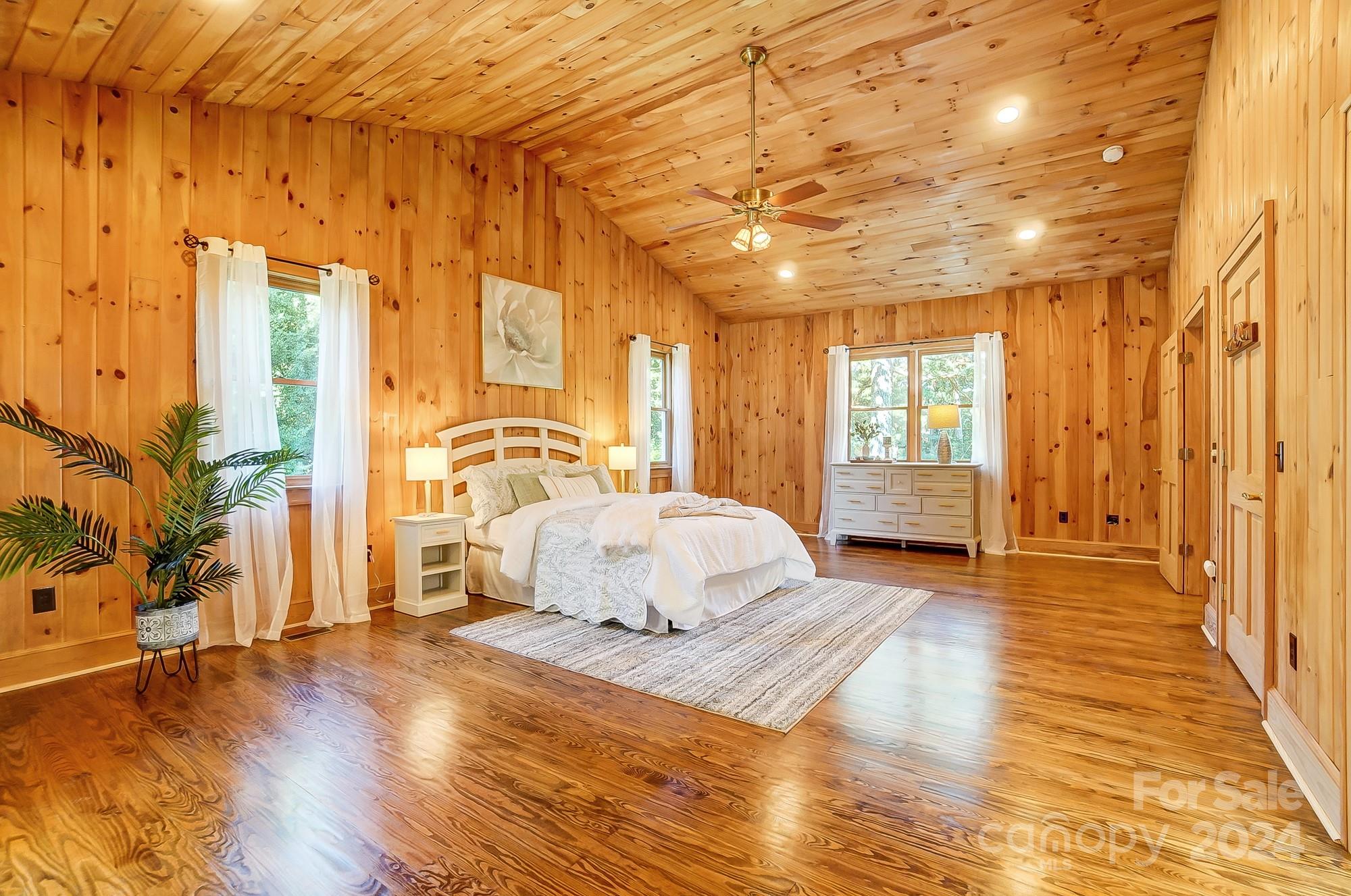 6338 Talley Road Stanfield, NC 28163 - Photo 34 of 48 a spacious bedroom with a bed and wooden floor