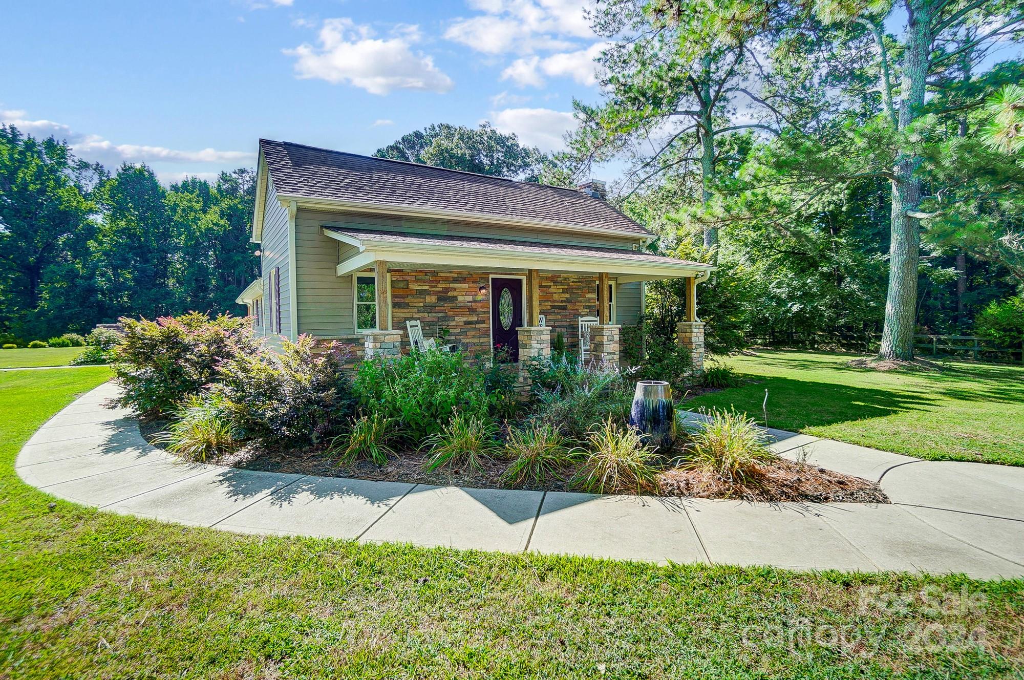 6338 Talley Road Stanfield, NC 28163 - Photo 4 of 48 a front view of a house with a yard