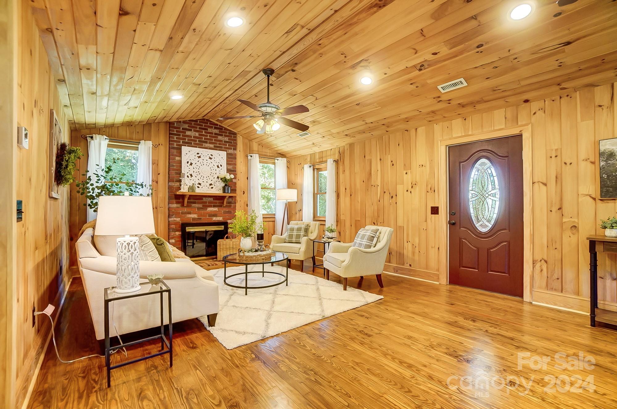 6338 Talley Road Stanfield, NC 28163 - Photo 8 of 48 a living room with fireplace furniture and a large window