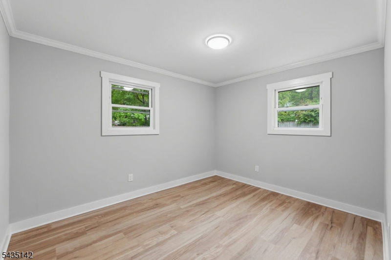 36 Ruth Street Hopatcong, NJ 07874 - Photo 13 of 25 wooden floor in an empty room with a window