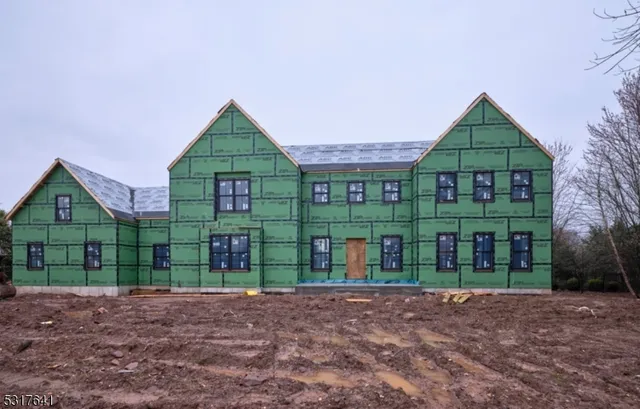 a front view of a house with a yard and outdoor