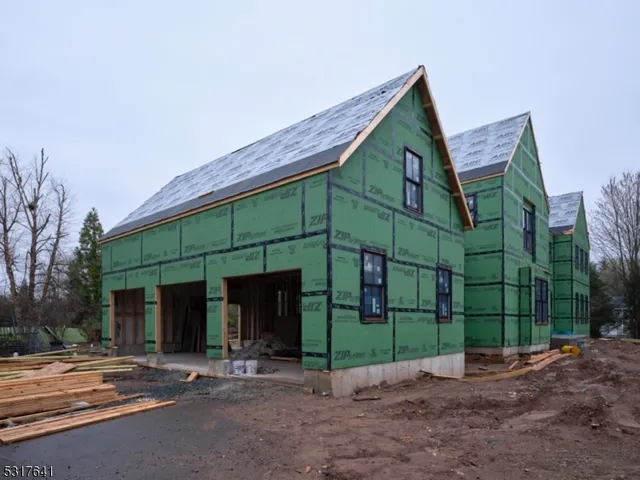 a view of a house with a yard and plants
