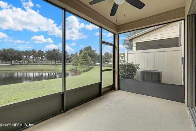 a view of a lake with houses in the background