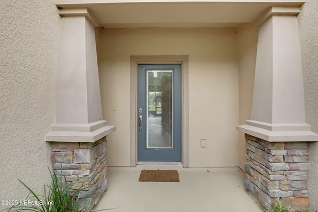 a view of an empty room with a bathroom