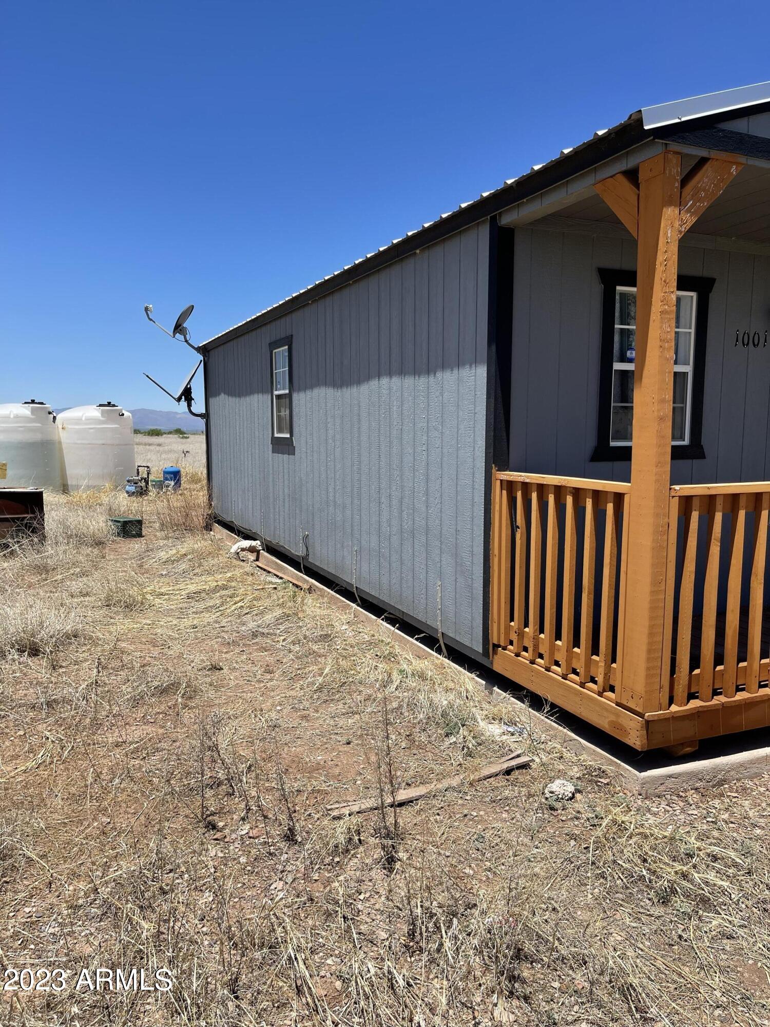 1001 East Mazatlan Street Douglas, AZ 85607 - Photo 11 of 28 a backyard of a house with wooden fence