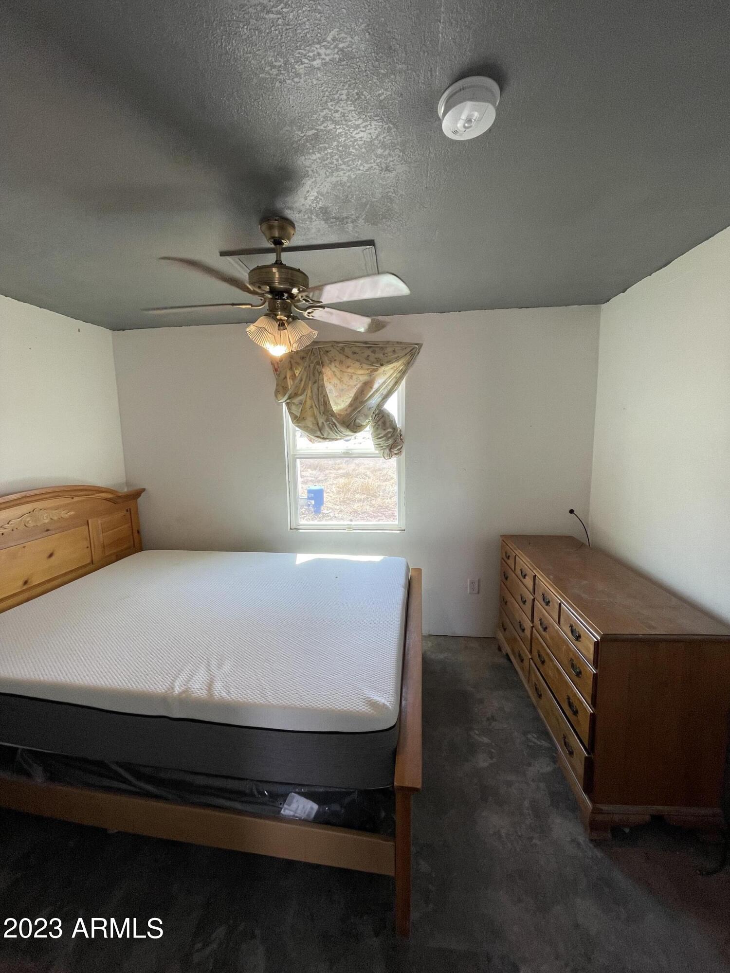 1001 East Mazatlan Street Douglas, AZ 85607 - Photo 17 of 28 a room with table and window