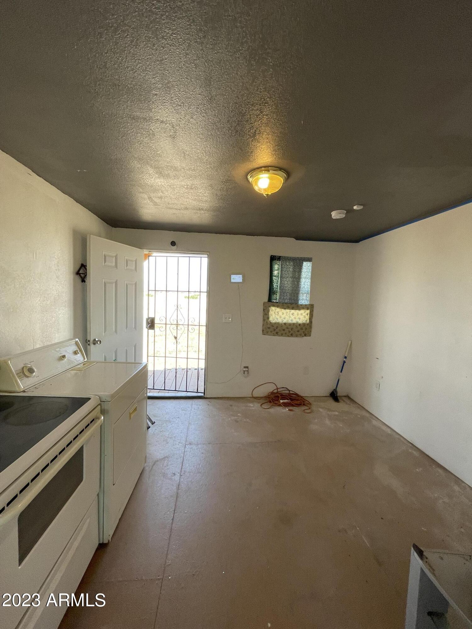 1001 East Mazatlan Street Douglas, AZ 85607 - Photo 22 of 28 a view of a kitchen with stainless steel appliances granite countertop a sink and a stove