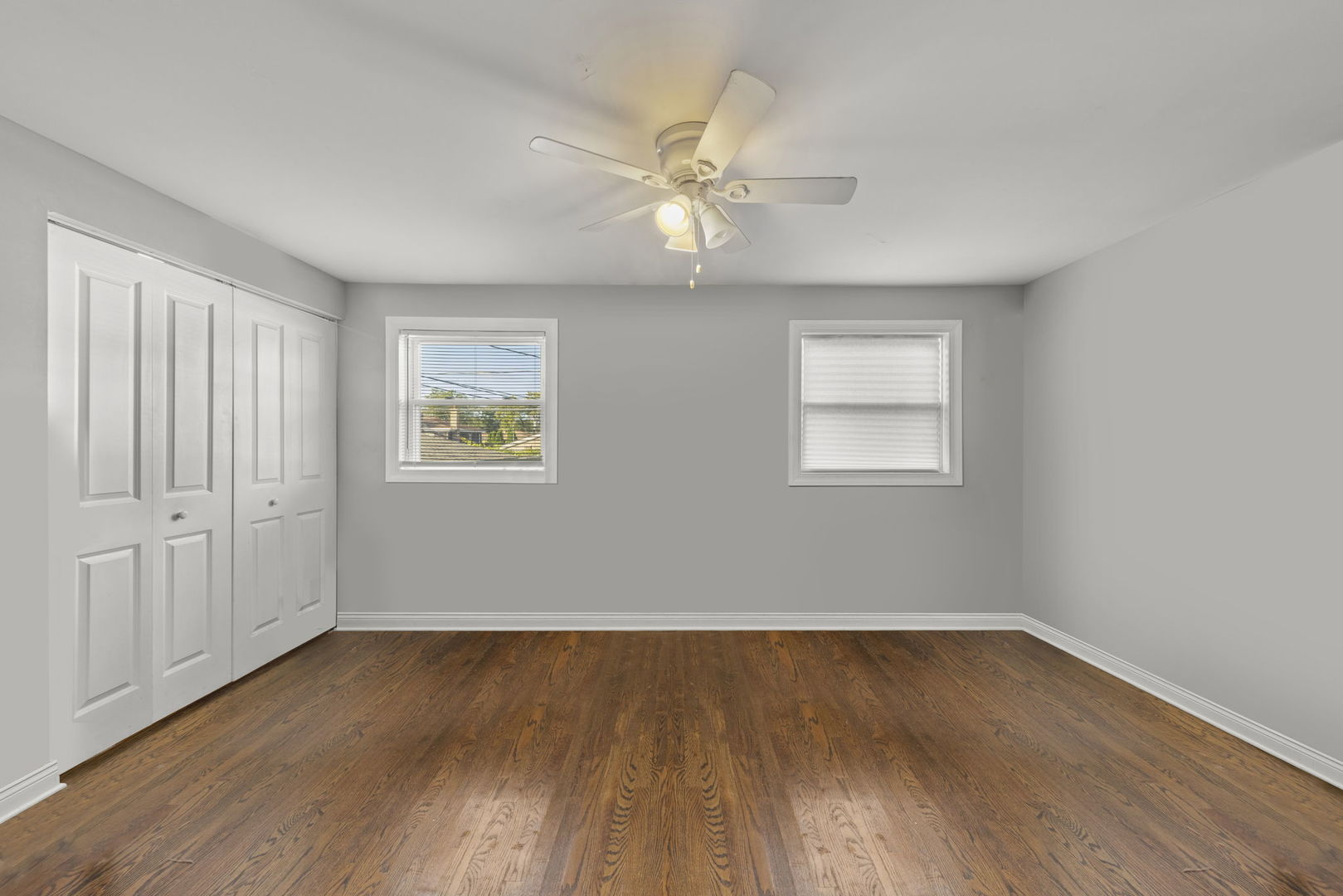 11616 South Racine Avenue Chicago, IL 60643 - Photo 9 of 13 an empty room with wooden floor closet and windows