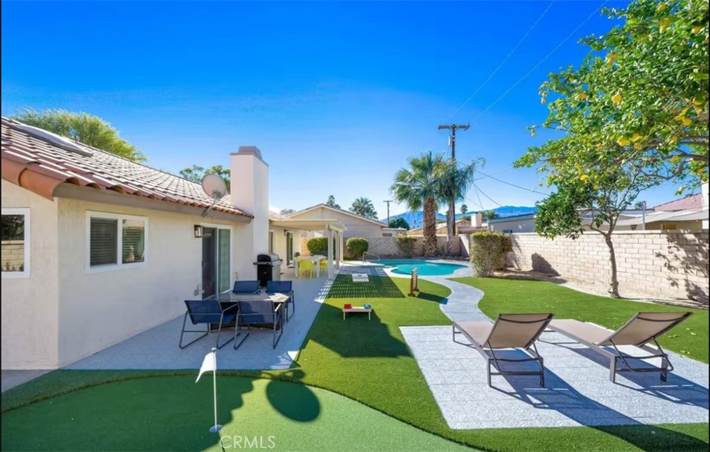 41775 Petersfield Road Bermuda Dunes, CA 92203 - Photo 1 of 1 a house view with a sitting space and garden