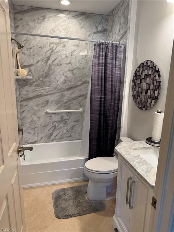 15890 Delasol Lane Naples, FL 34110 - Photo 5 of 16 a bathroom with a granite countertop sink toilet and shower