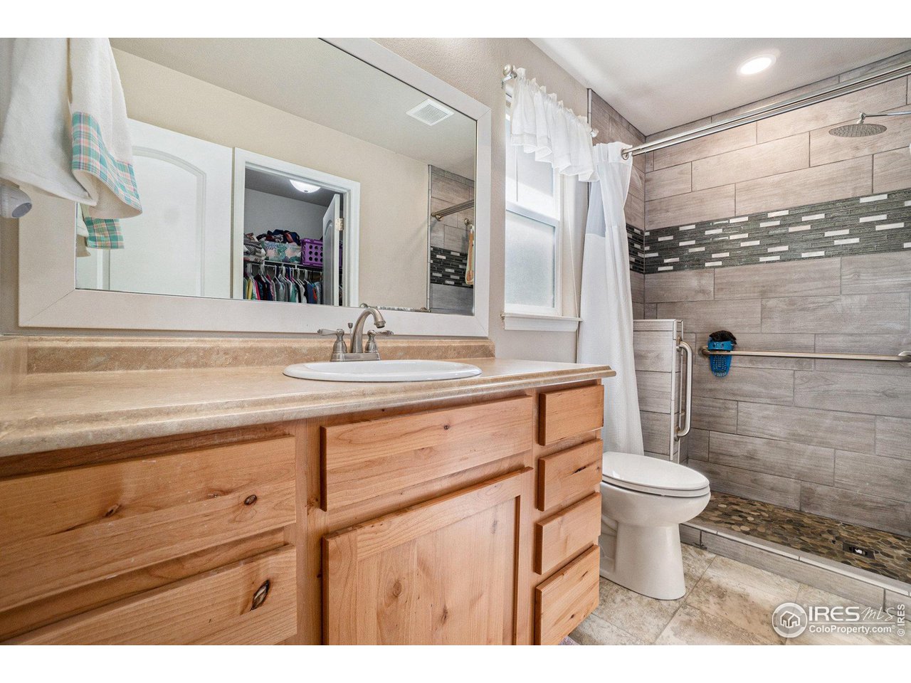 2185 Grain Bin Windsor, CO 80550 - Photo 14 of 22 a bathroom with a sink toilet and shower