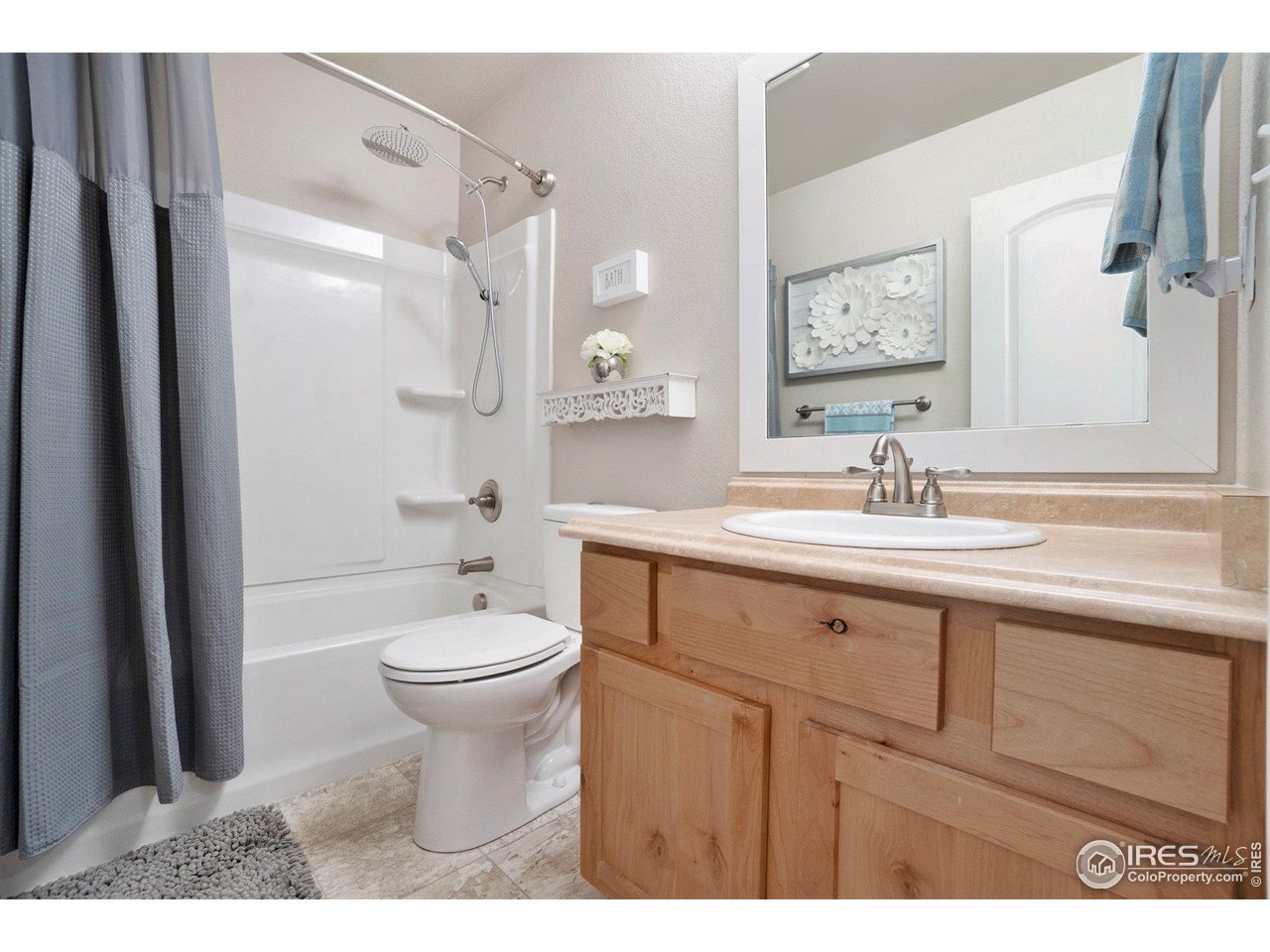 2185 Grain Bin Windsor, CO 80550 - Photo 17 of 22 a bathroom with a sink a toilet and shower