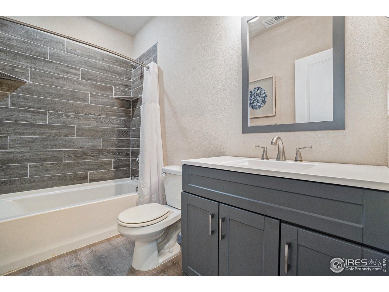 2185 Grain Bin Windsor, CO 80550 - Photo 20 of 22 a bathroom with a sink a toilet and shower
