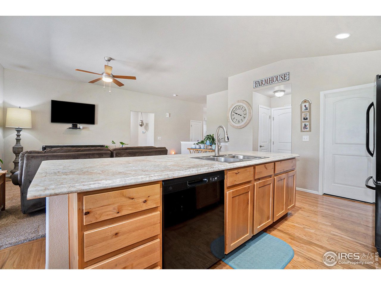 2185 Grain Bin Windsor, CO 80550 - Photo 5 of 22 a spacious bathroom with a granite countertop sink and a mirror