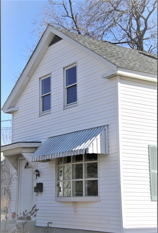 a front view of a house with a glass windows