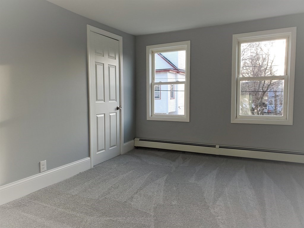 16 Court Street Lowell, MA 01852 - Photo 11 of 14 an empty room with windows