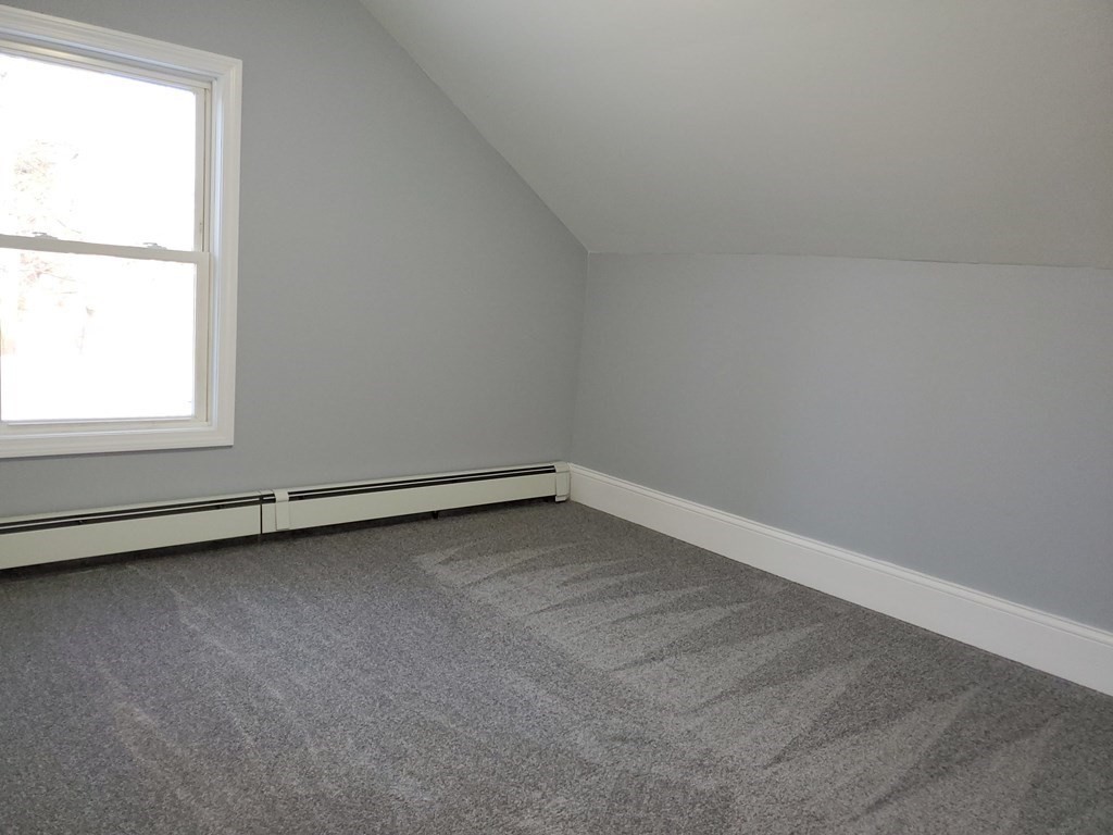 16 Court Street Lowell, MA 01852 - Photo 13 of 14 an empty room with a window