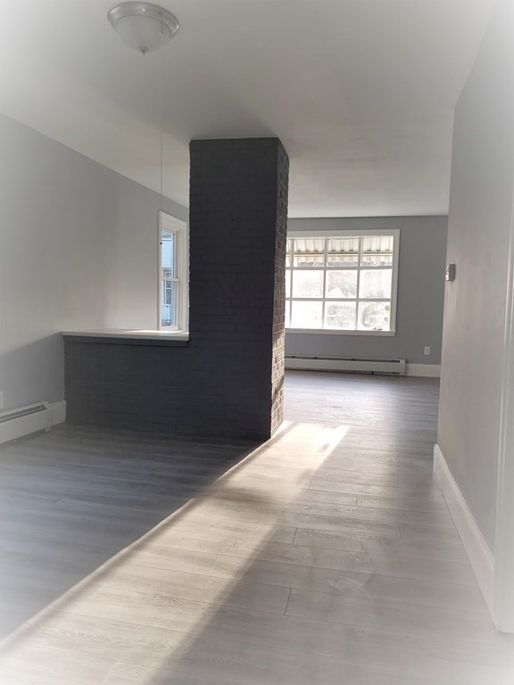 16 Court Street Lowell, MA 01852 - Photo 4 of 14 an empty room with windows