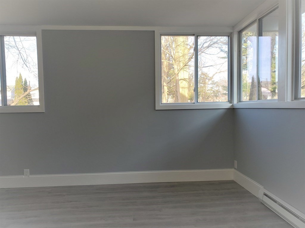 16 Court Street Lowell, MA 01852 - Photo 7 of 14 an empty room with a window