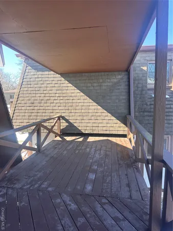 a view of wooden floor with staircase
