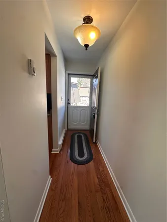 a view of entryway with wooden floor