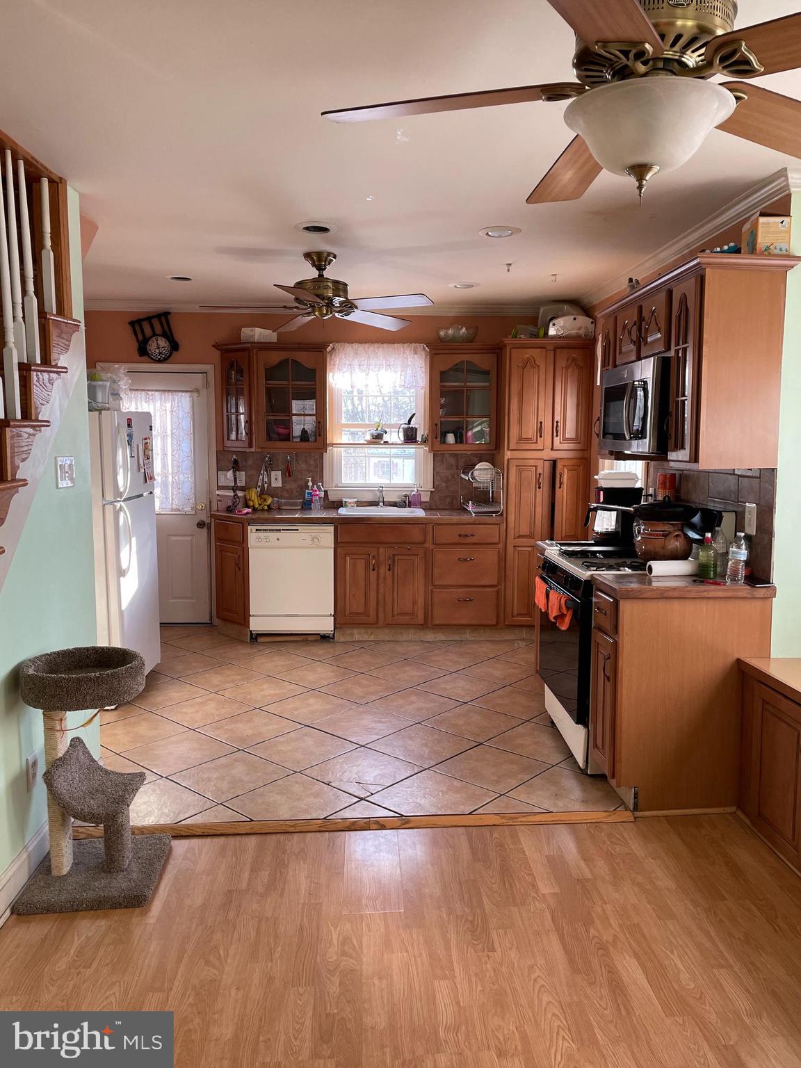 60 East Browning Road Bellmawr, NJ 08031 - Photo 2 of 13 a kitchen with stainless steel appliances granite countertop a sink and a stove