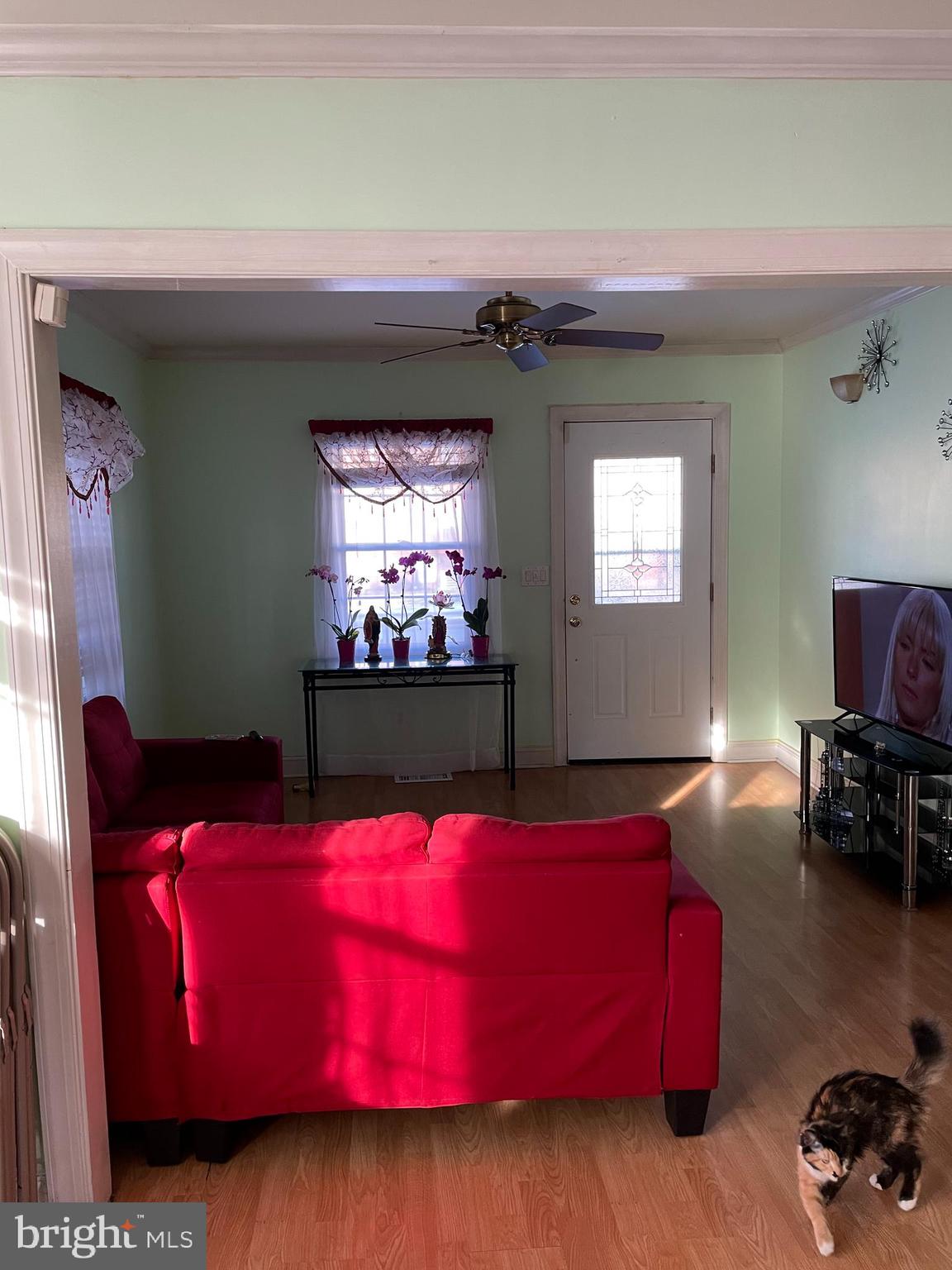 60 East Browning Road Bellmawr, NJ 08031 - Photo 3 of 13 a living room with furniture and a flat screen tv
