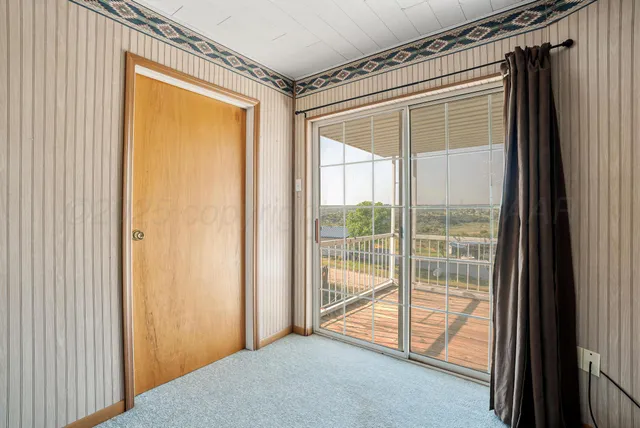 a view of a room with a large window