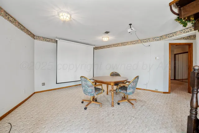 a view of a room with furniture and chandelier