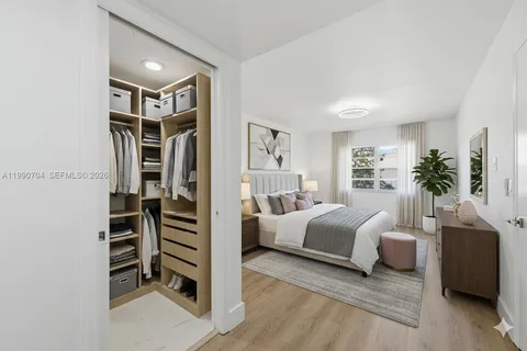 an empty room with windows and entrance