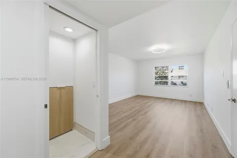 a bathroom with double vanity sinks and two mirror