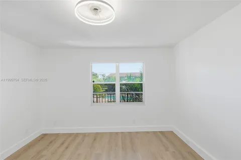 a bathroom with a bathtub sink mirror and toilet