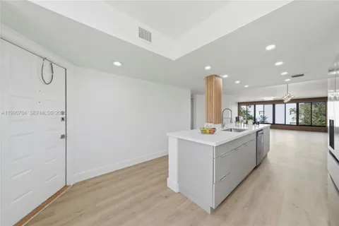 a view of kitchen with wooden floor
