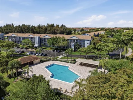 a view of a swimming pool and lounge chair