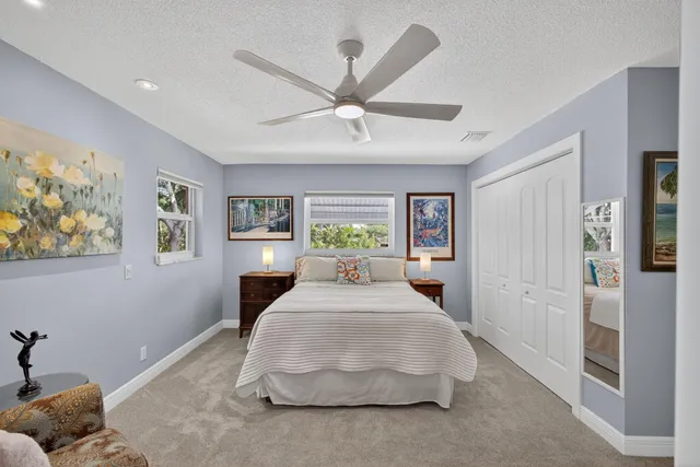 a dining room with furniture water view and a large window