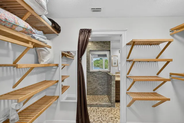 a living room with furniture a large window