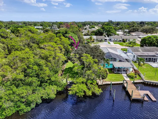 a view of a backyard with sitting area