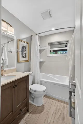 a view of a patio with table and chairs potted plants and a palm tree