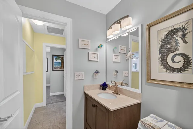 a view of a backyard with table and chairs and potted plants