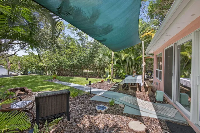 a view of a lake with boats and trees in the background