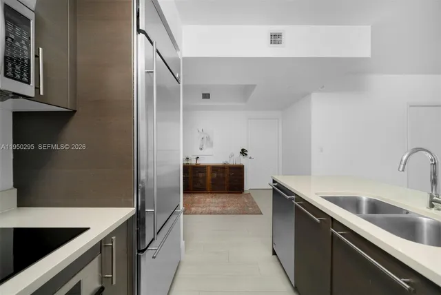 a kitchen with a sink and an oven
