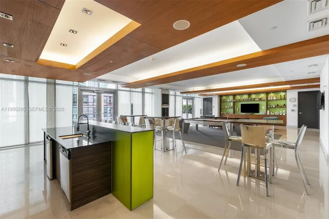 a view of a living room and kitchen