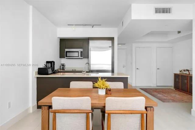 a view of a dining room with furniture